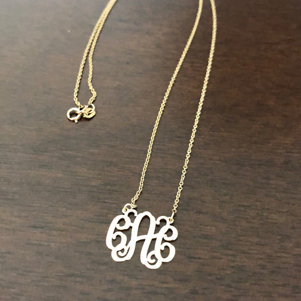 CAC monogram gold necklace